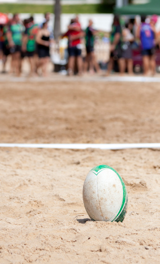 a rugby ball, after a game of beach rugby