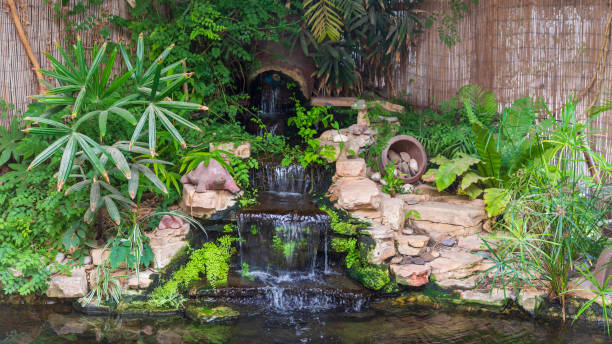 istock The decorative waterfall with plants and decorations 1366002937