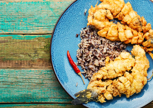 istock Deep fried sea bass with rice. 1366003090