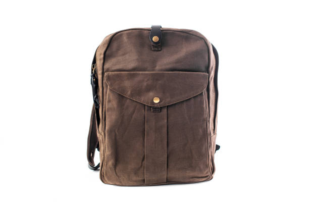 istock Canvas Backpack accessories isolated on white background. Hand made backpack for travelers. 1366003528