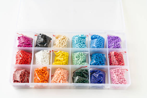 istock colorful beads in the container with cells. set for creativity and needlework. 1366005126