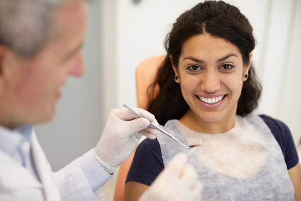 istock A dentist-patient is looking at the camera. 1366005182