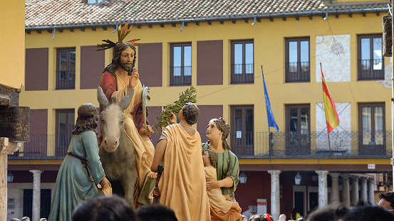 Representation of Palm Sunday, in a procession through the streets of a town in the province of Valladolid, Christ on a tassel is acclaimed by the people.