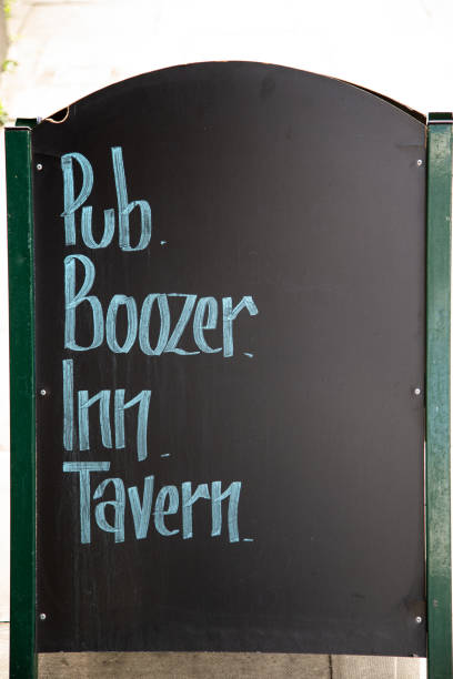 Pub and bar sign outside on the pavement