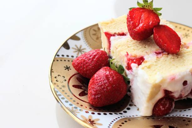 istock A slice of strawberry short cake on a plate 1366010961