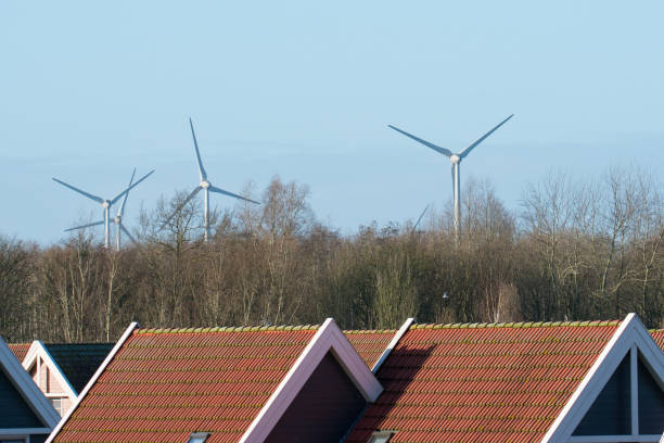 Windmills with holiday house in foreground Windmills in Flevoland, the Netherlands with holiday homes in the foreground. biddinghuizen stock pictures, royalty-free photos & images