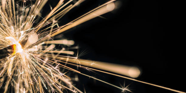 istock Sparkling Sparkler Against a Black Background with Copy Space 1366013324