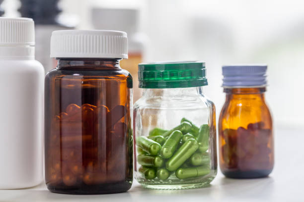 istock medicine bottle no label on white background 1366014221