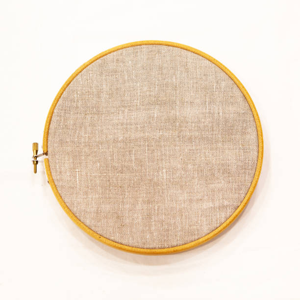 istock Embroidery hoop with natural linen fabric, as a template, isolate. Flat top view. 1366015684