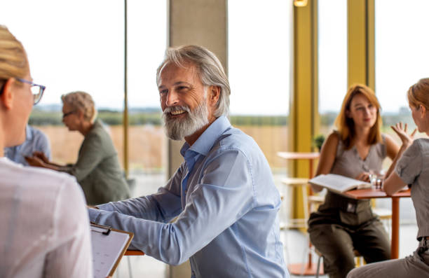 istock Business people having a meeting in a cafeteria 1366016197