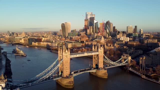 Aerial view of the Tower Bridge and the skyscrapers of the City of London