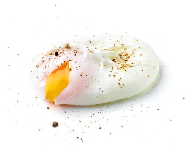 Poached egg and pepper isolated on white background