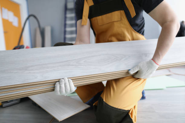 istock A repairman in uniform holds laminate panels, close-up 1366020216