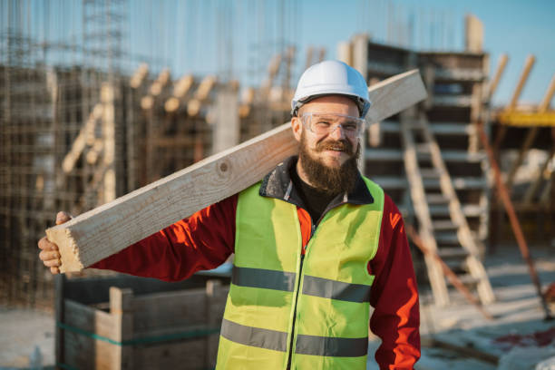 istock Portrait of manual worker on construction site. 1366020424