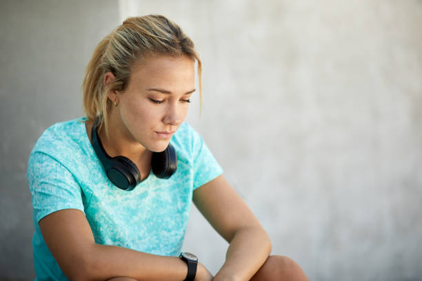 istock A runner sitting down and listening to music. 1366021494