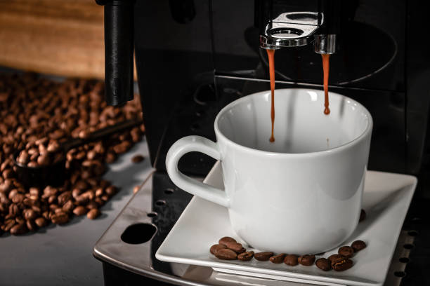 istock Espresso machine for making fresh coffee on a dark background. Coffee preparation. 1366023186