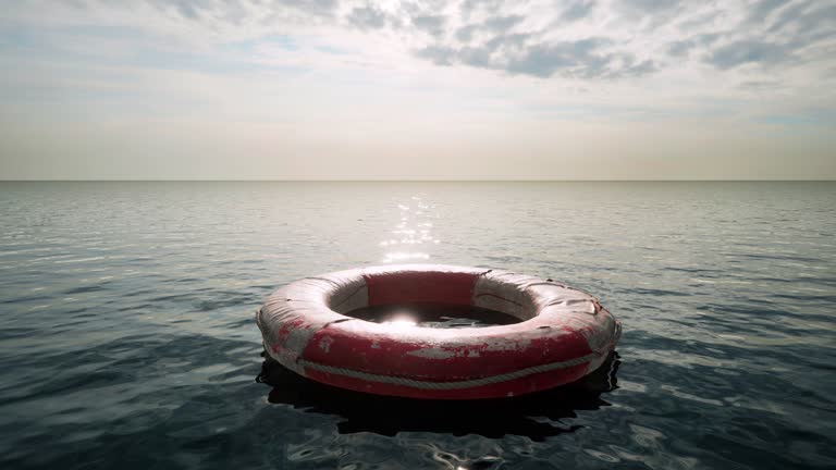 An abstract concept of a tragedy at sea with a lone lifebuoy floating slowly past the camera