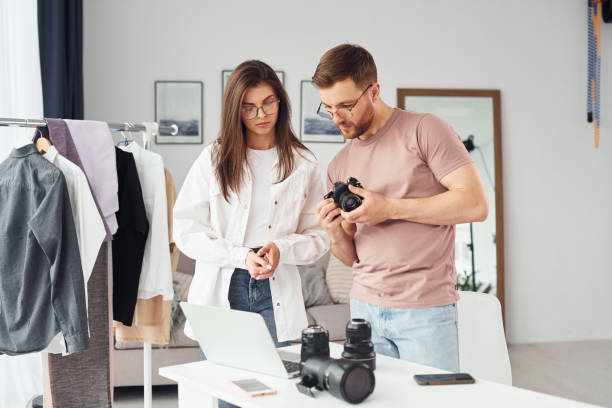 istock Photographers works indoors in their studio at daytime 1366025022