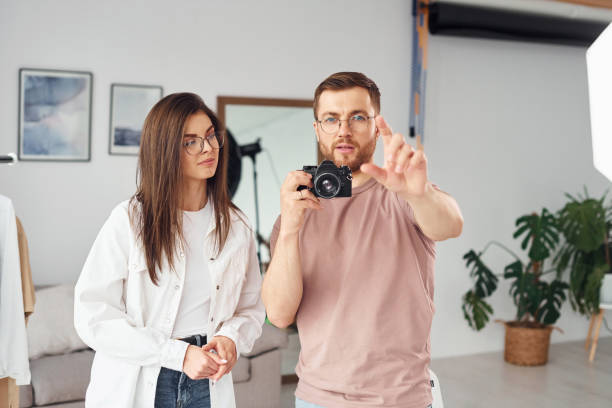 istock Photographers works indoors in their studio at daytime 1366025043