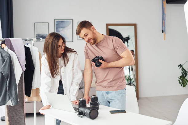 istock Photographers works indoors in their studio at daytime 1366025045