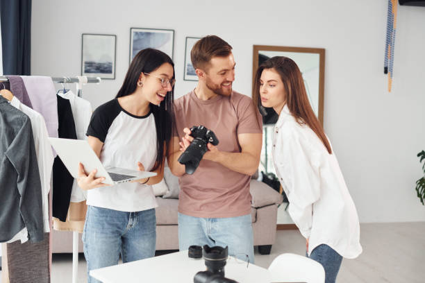 istock Preparing model. Photographers works indoors in their studio at daytime 1366025121