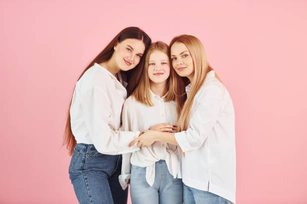 istock Young mother with her two daughters is in the studio 1366025454