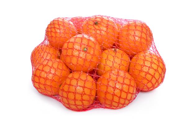 istock Ripe tangerines in the net bag on a white background 1366028466