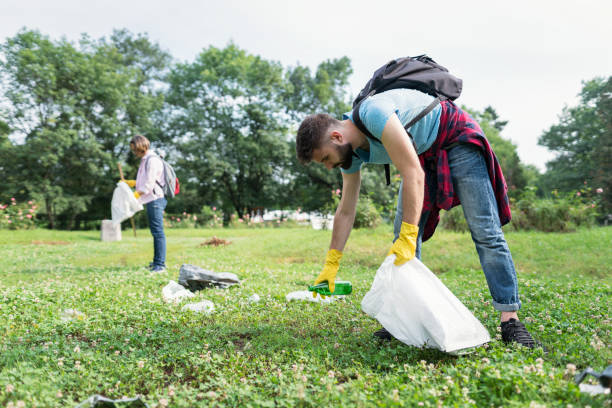 istock Volunteers cleaning local park 1366030315