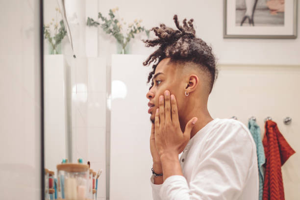 istock At home - young man brushing his teeth 1366030679