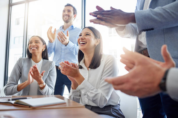 Shot of a group of businesspeople clapping hands in a meeting at work Something good always comes from these meetings clapping hands stock pictures, royalty-free photos & images