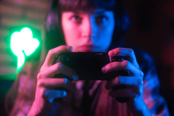 young woman gamer hands - retro revival video game joystick gamer imagens e fotografias de stock