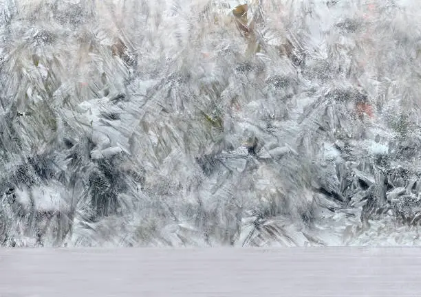 frozen window with frosty patterns