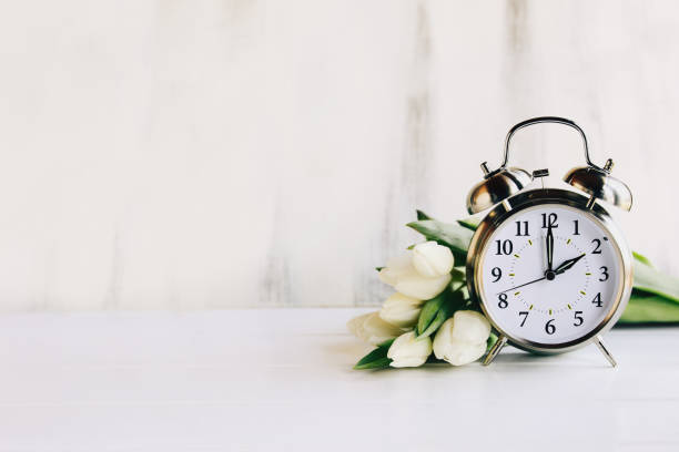 istock White Tulips and Daylight Savings Time with Copy Space 1366033757