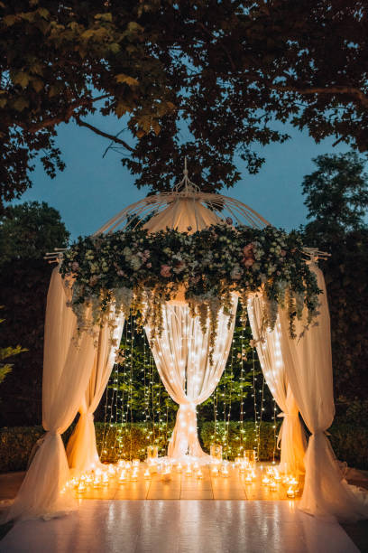 istock wedding arch evening magic decor floral candles 1366036642