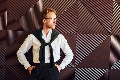 Waiter in uniform. Indoors of new modern luxury restaurant.