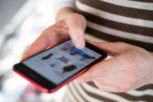 istock Shopping Online With Phone 1366040328