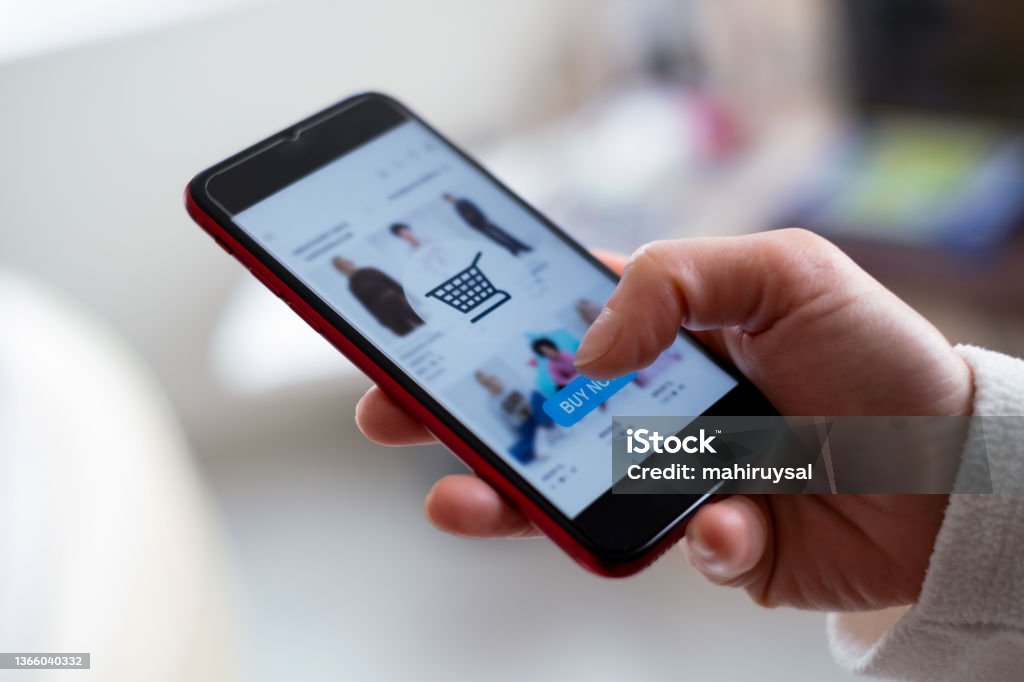 Shopping Online With Phone Online shopping on smartphone. Online Shopping Stock Photo