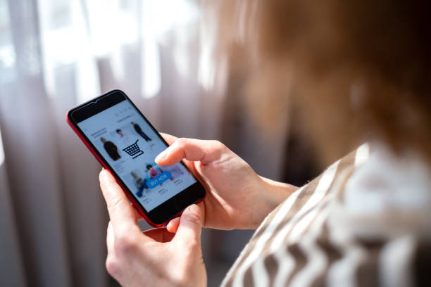 istock Shopping Online With Phone 1366040337