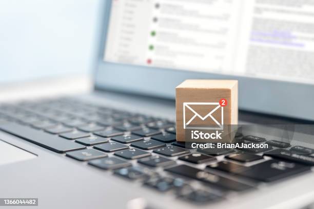 New Email Symbol On Wooden Block On Laptop Keyboard Stock Photo - Download Image Now