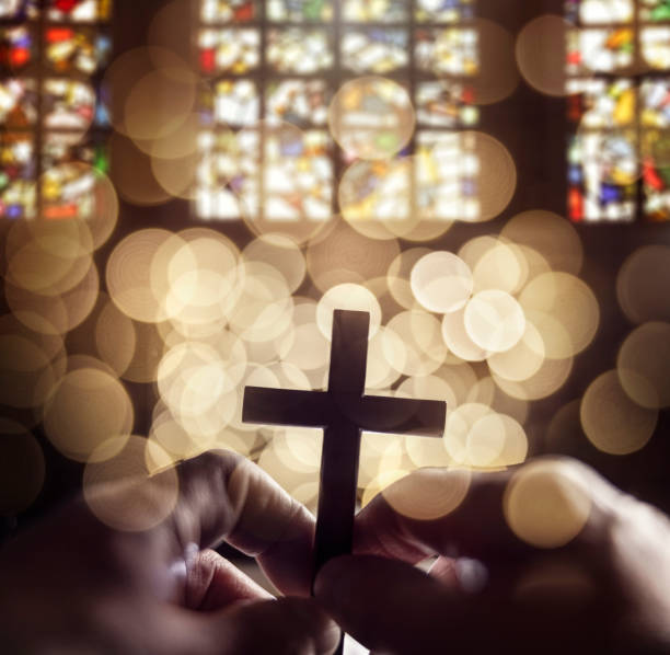 istock Abstract religious crucifix cross in church interior 1366044492