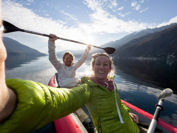 istock Couple taking cool selfie on a canoe trip 1366045451