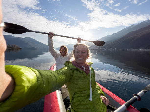 istock Couple taking cool selfie on a canoe trip 1366045494