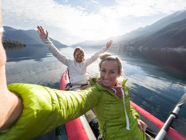 istock Couple taking cool selfie on a canoe trip 1366045510