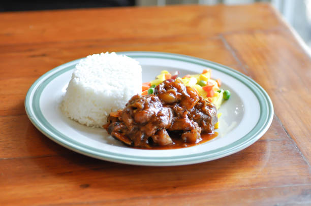 istock stewed pork ,pork with rice and sauce or rice with stew pork 1366046255