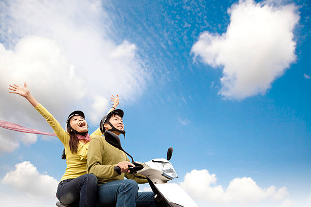 istock Happy young couple on scooter 136605059