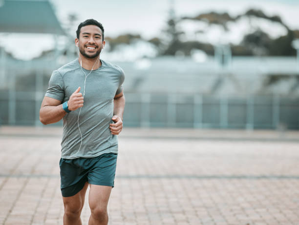 istock Shot of a young man going for a morning run 1366052178
