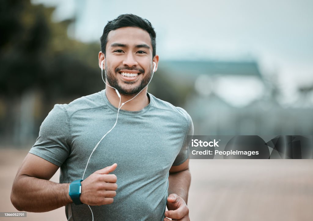 Shot of a young man going for a morning run It's a great way to clear my head Running Stock Photo