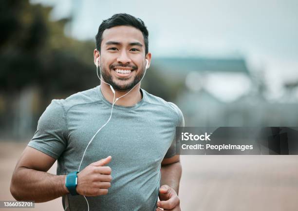 Shot Of A Young Man Going For A Morning Run Stock Photo - Download Image Now - Running, Men, Exercising