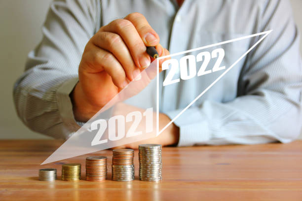 istock worker used pen made saving plan 2021 to 2022 , saving concept 1366053488