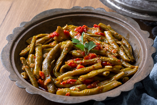 Traditional delicious Turkish food; Green beans with olive oil; Turkish name; Zeytinyagli taze fasulye.